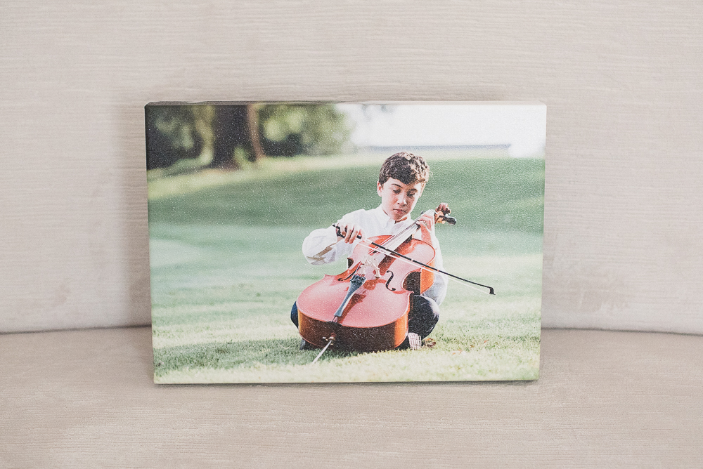Boy playing cello on grass canvas by Keli Melo photographer Plano TX